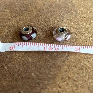 Pandora 925 sterling silver 2 charms for bracelet. Purple/white and clear/pink.